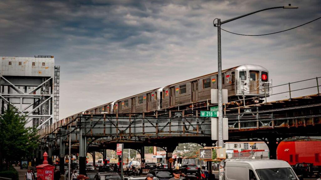Navigating Manhattan easily using trains, Aerial view of Manhattan streets with yellow taxis and pedestrians in 2024
